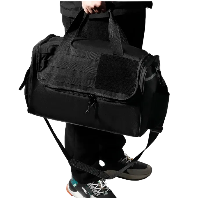 Black tactical duffel bag being carried by a person on a white background